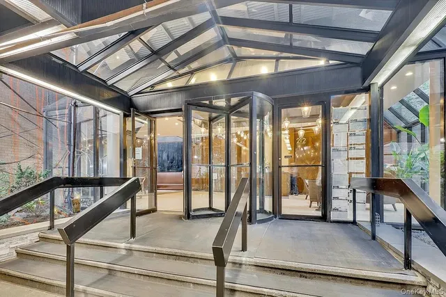 a view of staircase with a rug