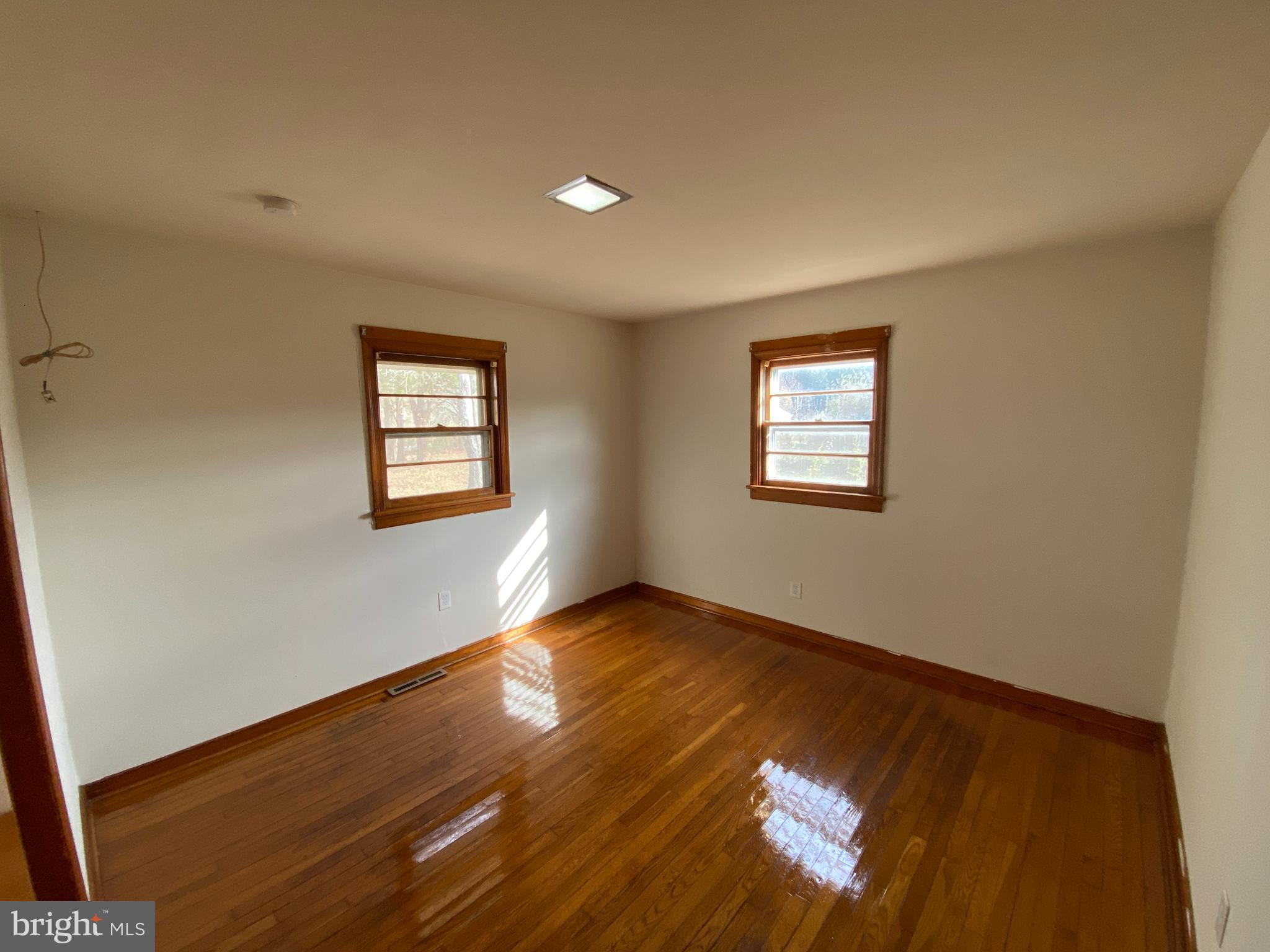 10514 Robert E Lee Drive Spotsylvania, VA 22551 - Photo 14 of 28 a view of an empty room with window and wooden floor