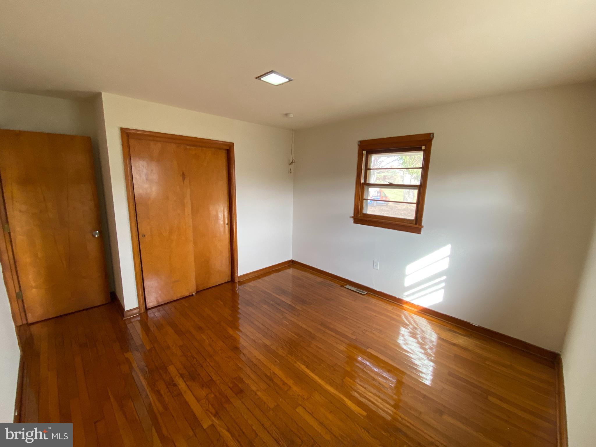 10514 Robert E Lee Drive Spotsylvania, VA 22551 - Photo 15 of 28 an empty room with wooden floor and windows