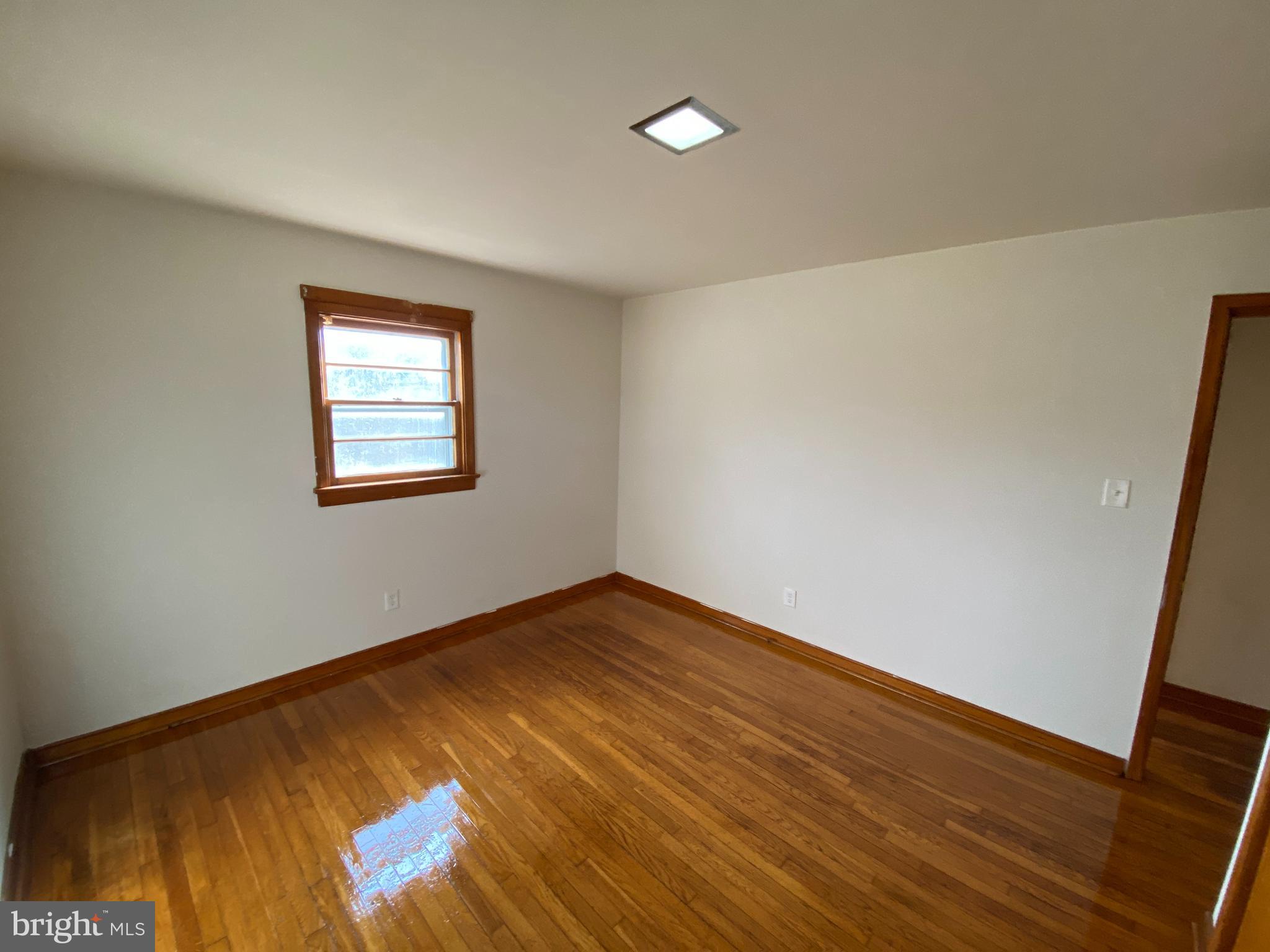 10514 Robert E Lee Drive Spotsylvania, VA 22551 - Photo 17 of 28 a view of empty room with wooden floor and fan