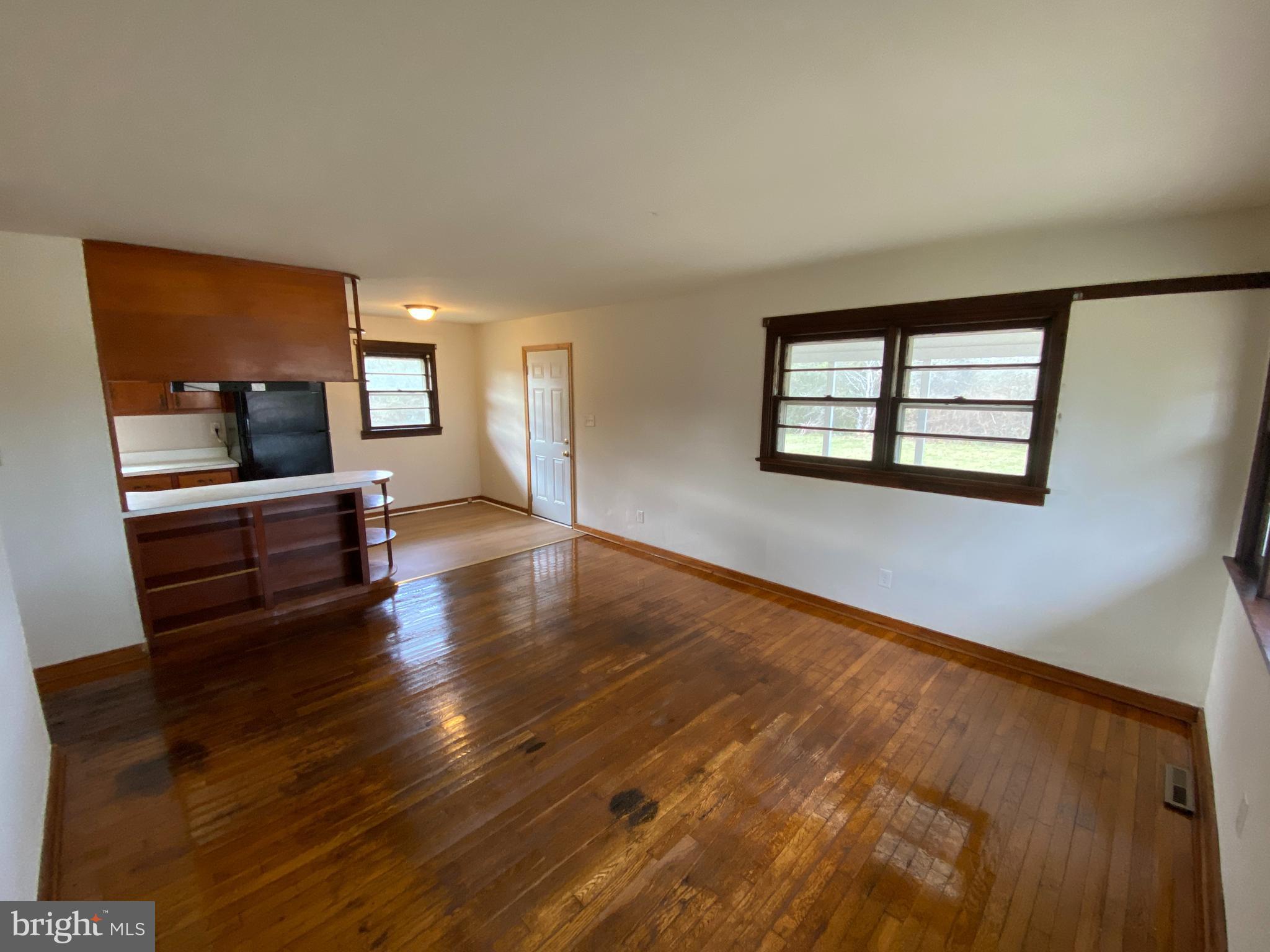 10514 Robert E Lee Drive Spotsylvania, VA 22551 - Photo 2 of 28 wooden floor in an empty room with a window