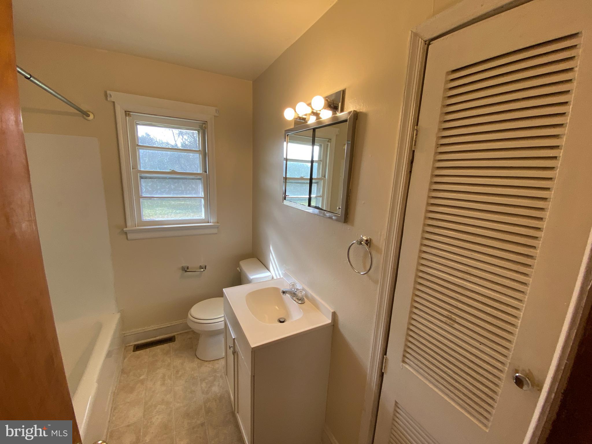 10514 Robert E Lee Drive Spotsylvania, VA 22551 - Photo 8 of 28 a bathroom with a sink toilet and shower