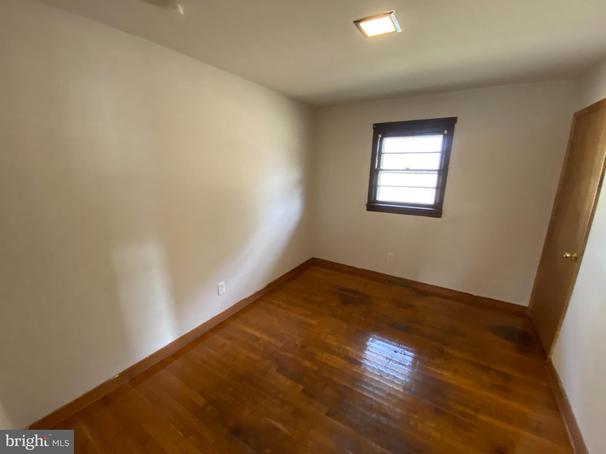 10514 Robert E Lee Drive Spotsylvania, VA 22551 - Photo 10 of 28 an empty room with wooden floor and windows