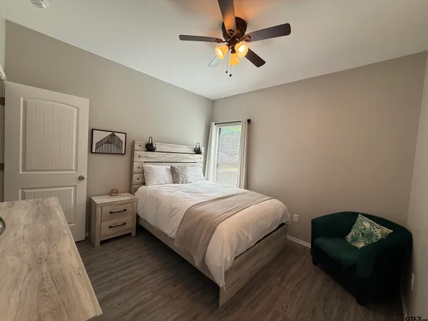 a bedroom with a bed and window