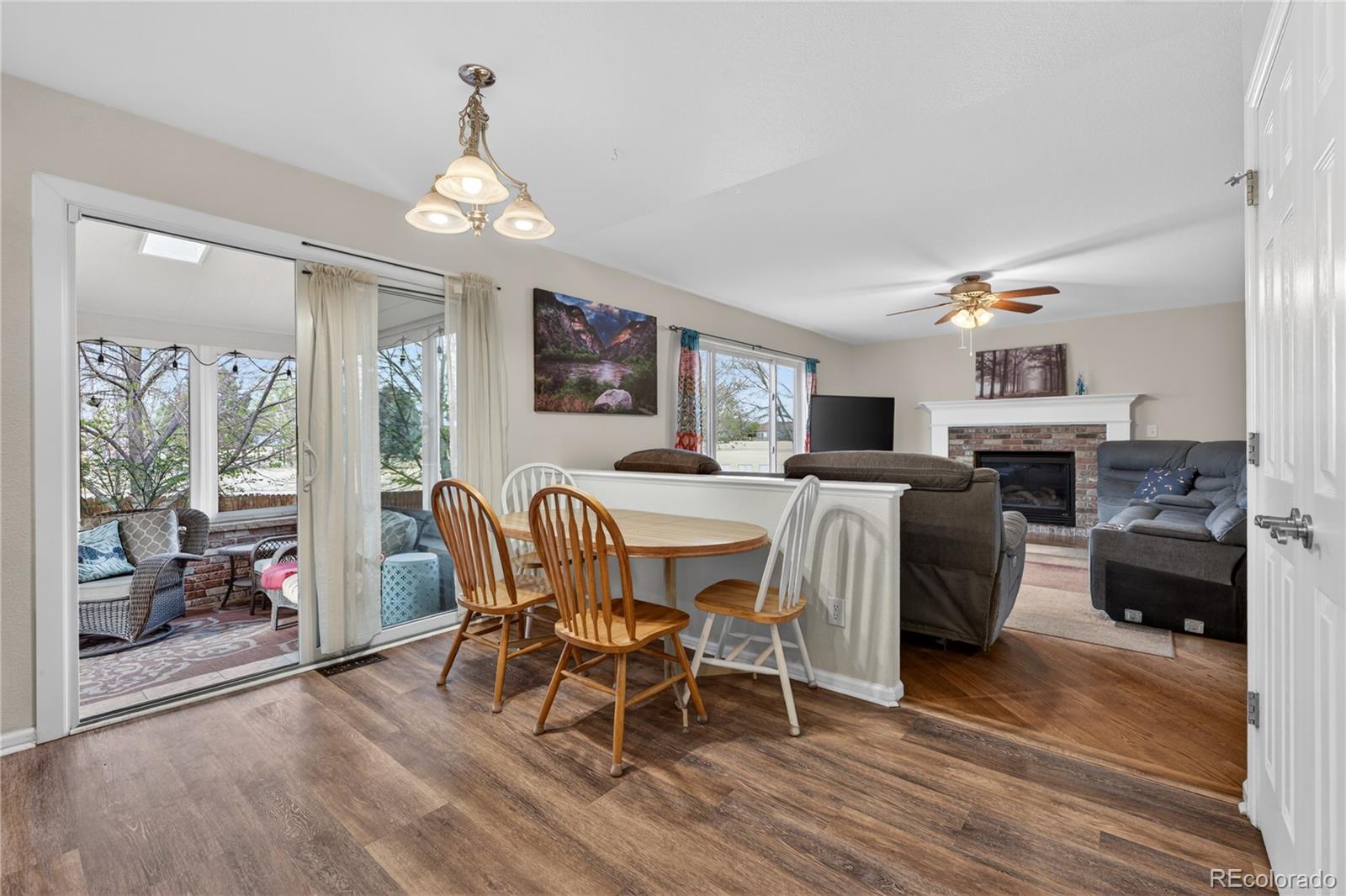 6289 Viewpoint Avenue Firestone, CO 80504 - Photo 15 of 45 a living room with furniture and a fireplace