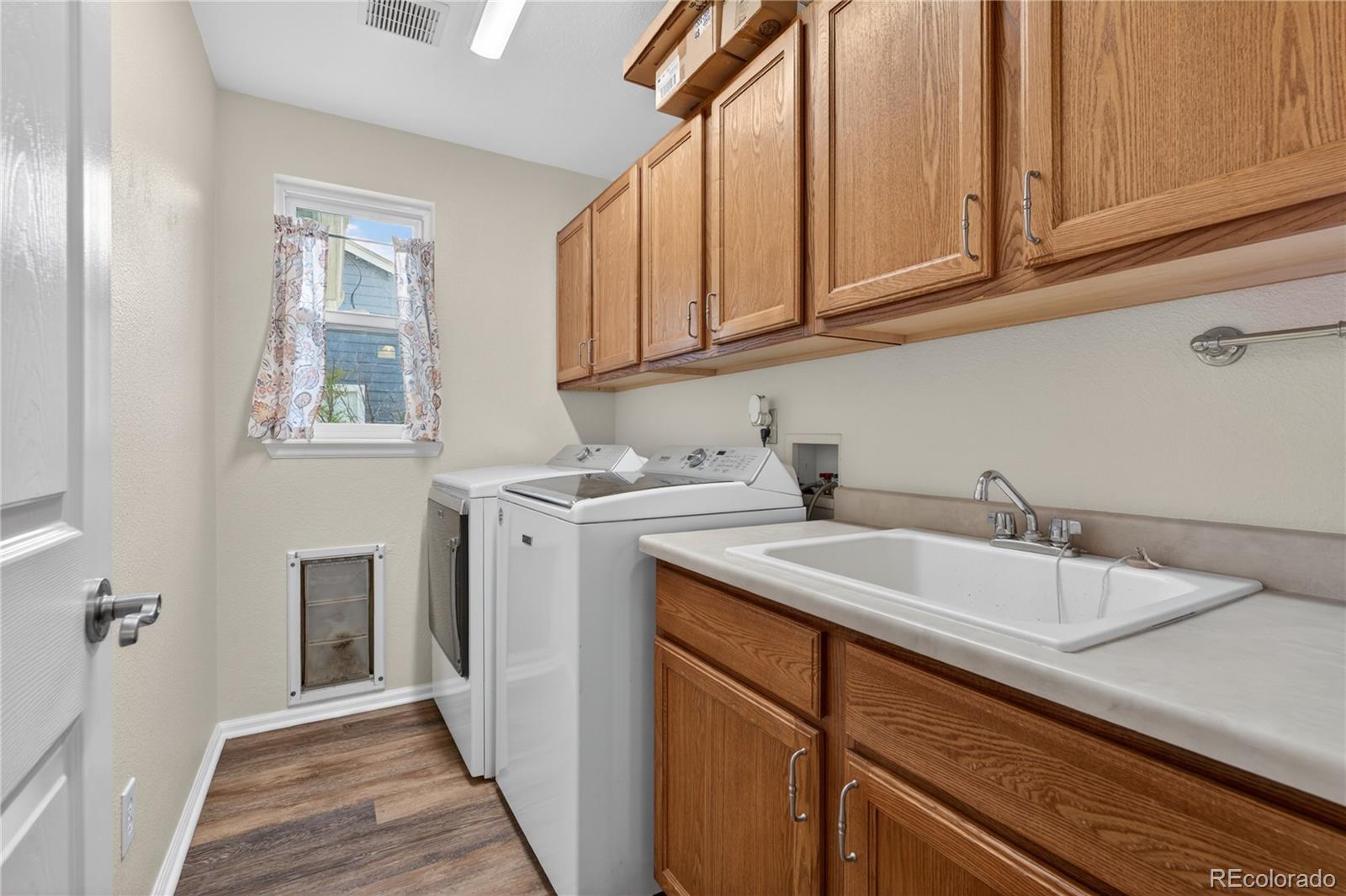 6289 Viewpoint Avenue Firestone, CO 80504 - Photo 19 of 45 a kitchen with stainless steel appliances granite countertop a sink and dishwasher