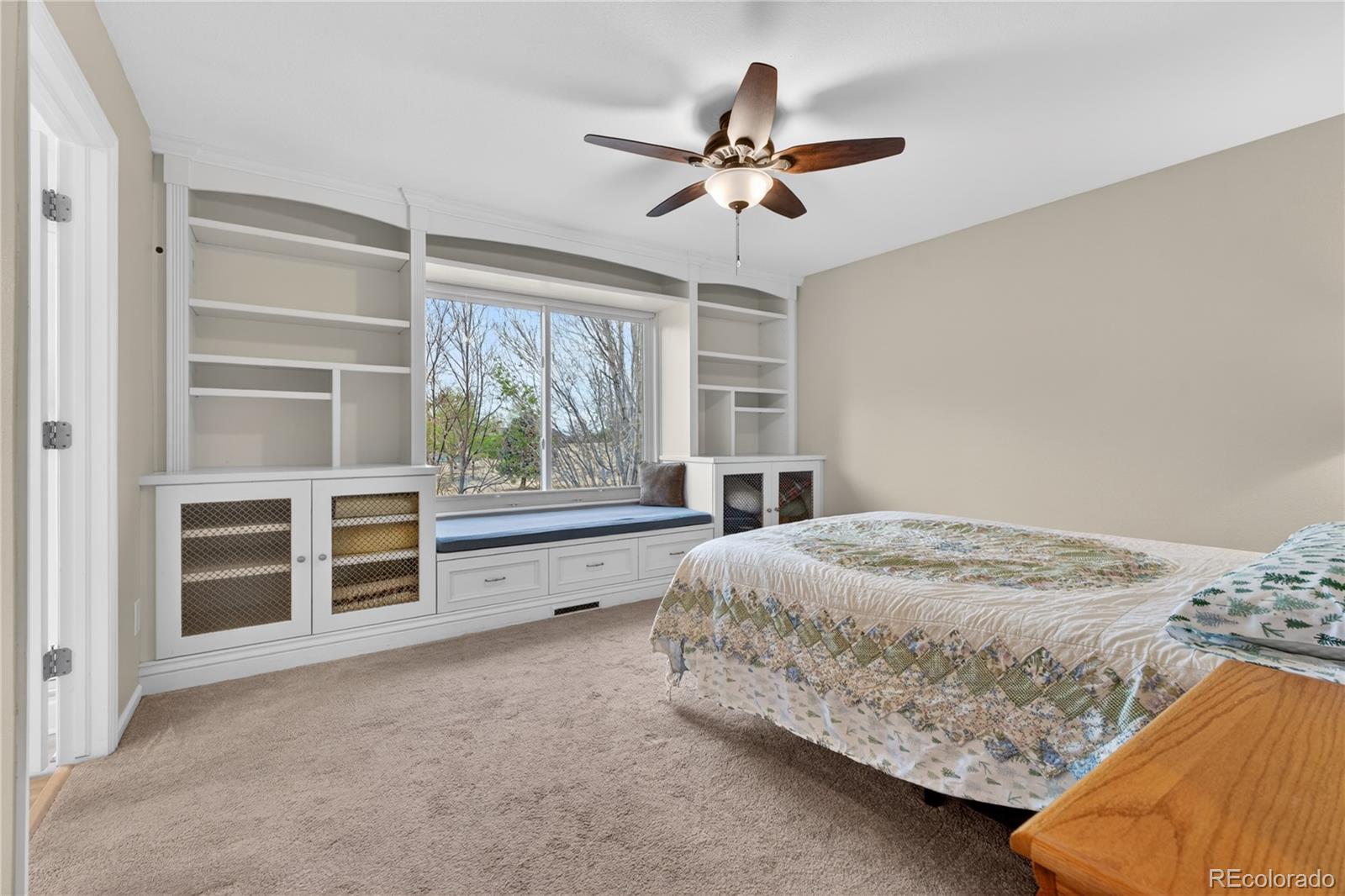 6289 Viewpoint Avenue Firestone, CO 80504 - Photo 20 of 45 a bedroom with a bed and a window