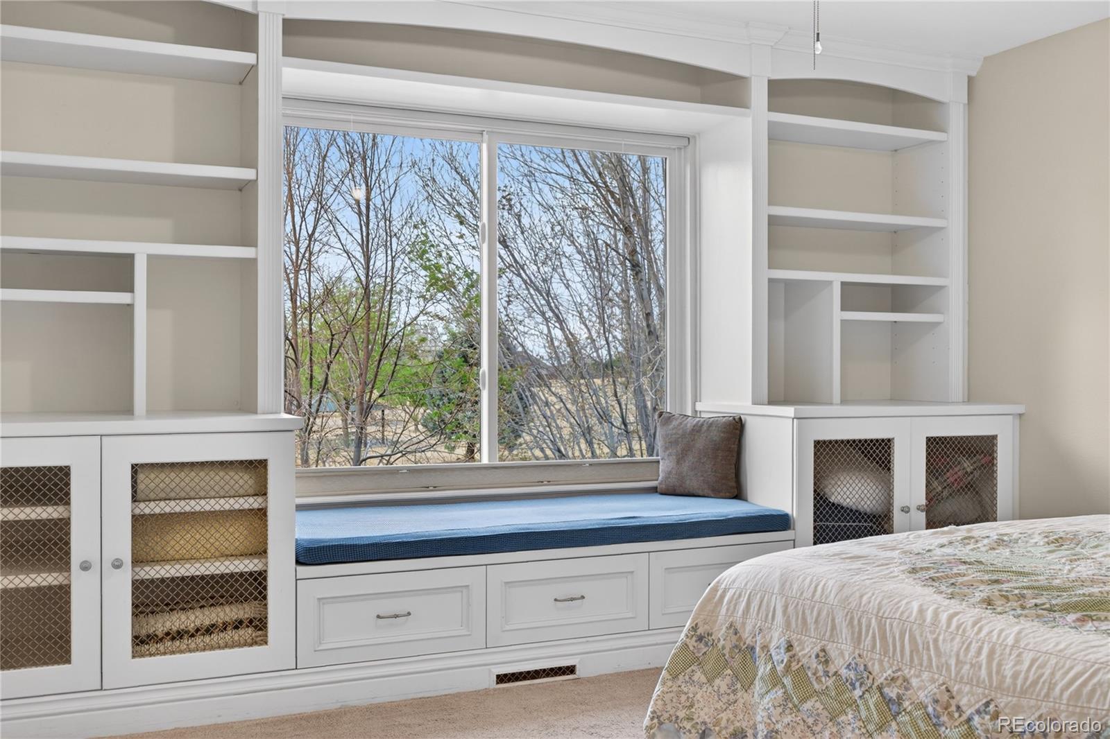 6289 Viewpoint Avenue Firestone, CO 80504 - Photo 21 of 45 a bedroom with a bed and a large window