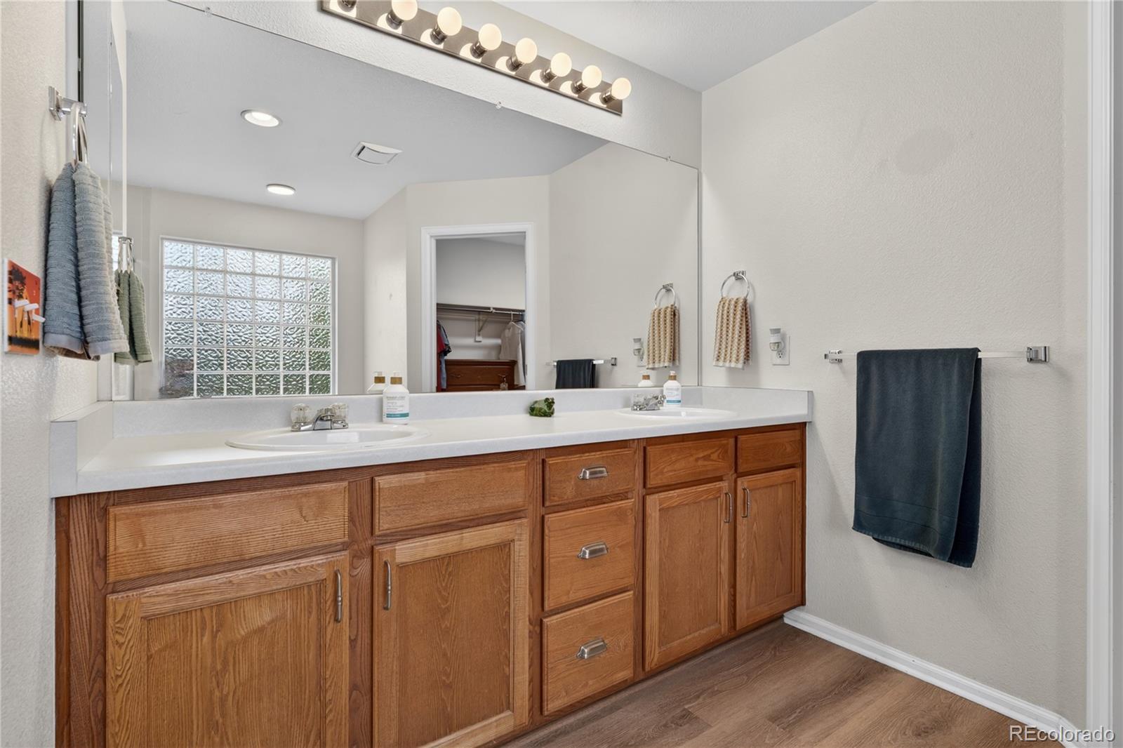 6289 Viewpoint Avenue Firestone, CO 80504 - Photo 23 of 45 a bathroom with a double vanity sink and a mirror