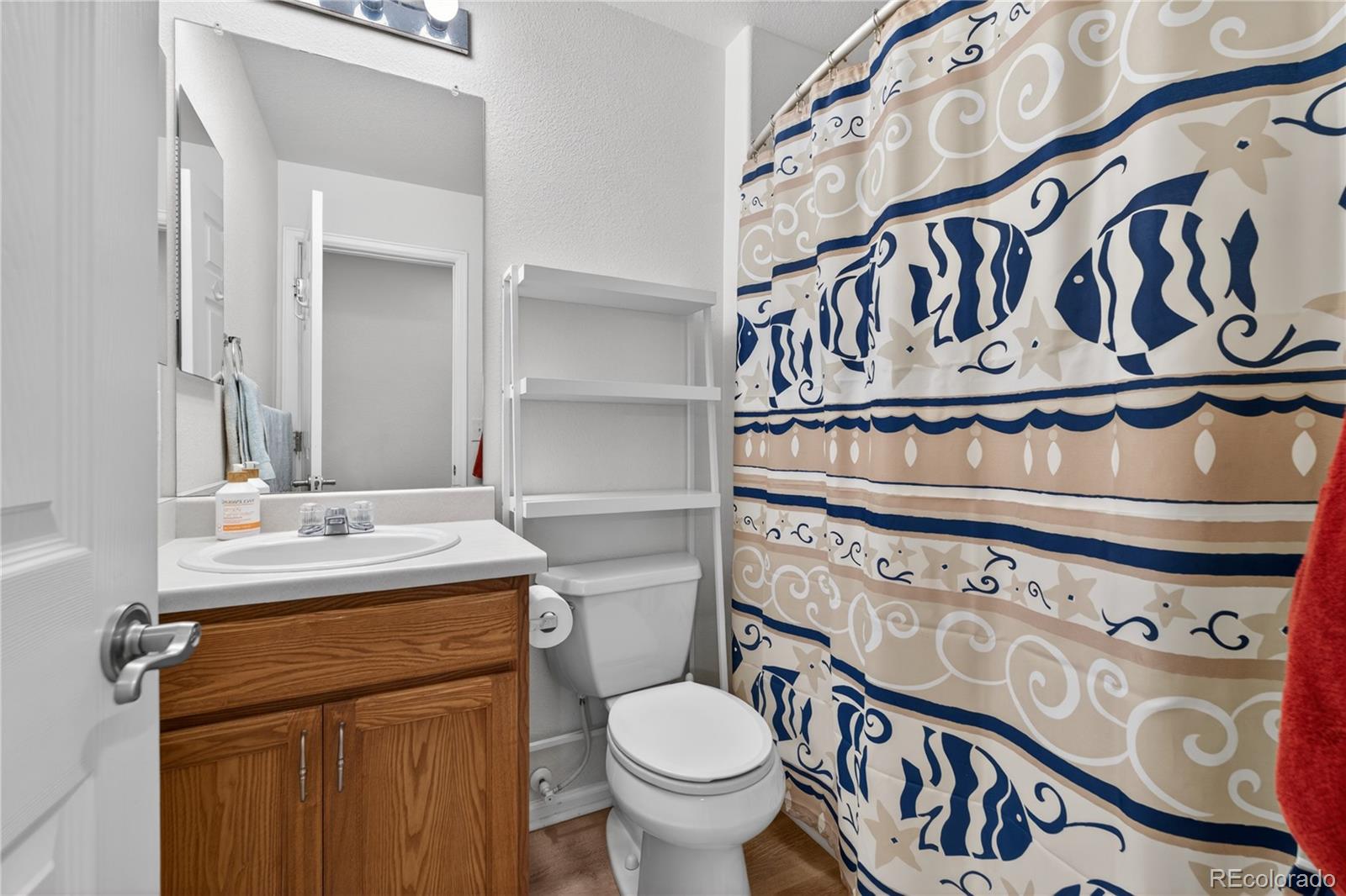 6289 Viewpoint Avenue Firestone, CO 80504 - Photo 30 of 45 a bathroom with a sink and a toilet