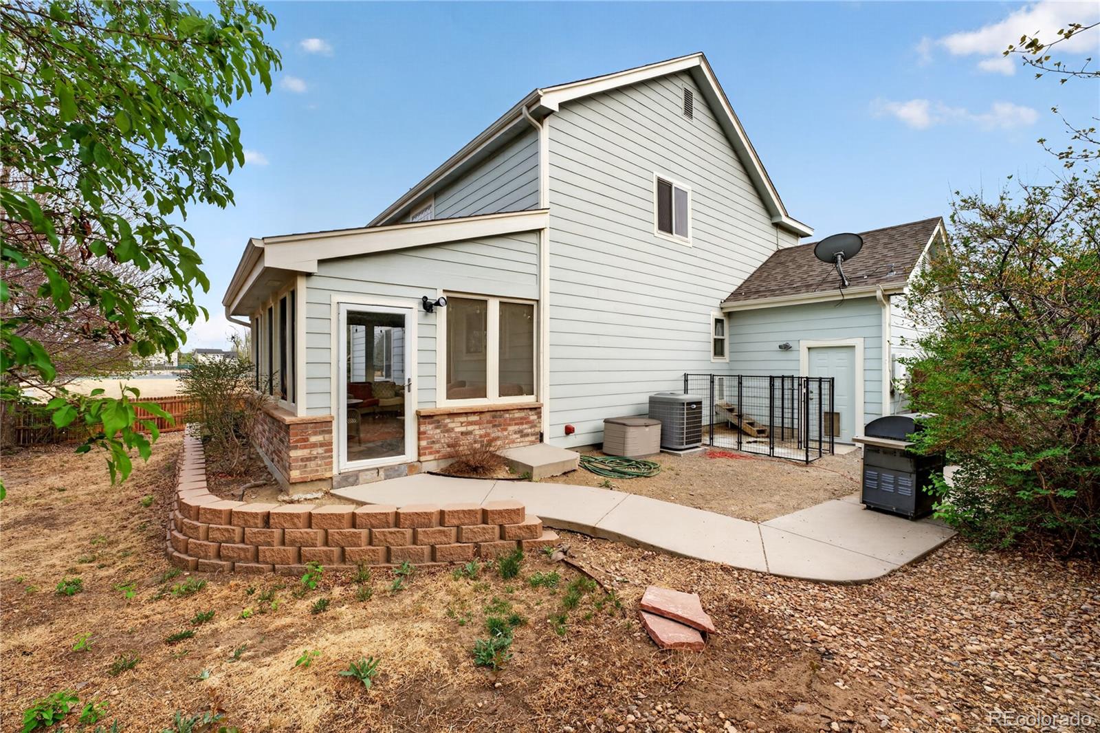 6289 Viewpoint Avenue Firestone, CO 80504 - Photo 35 of 45 a view of a house with backyard and sitting area