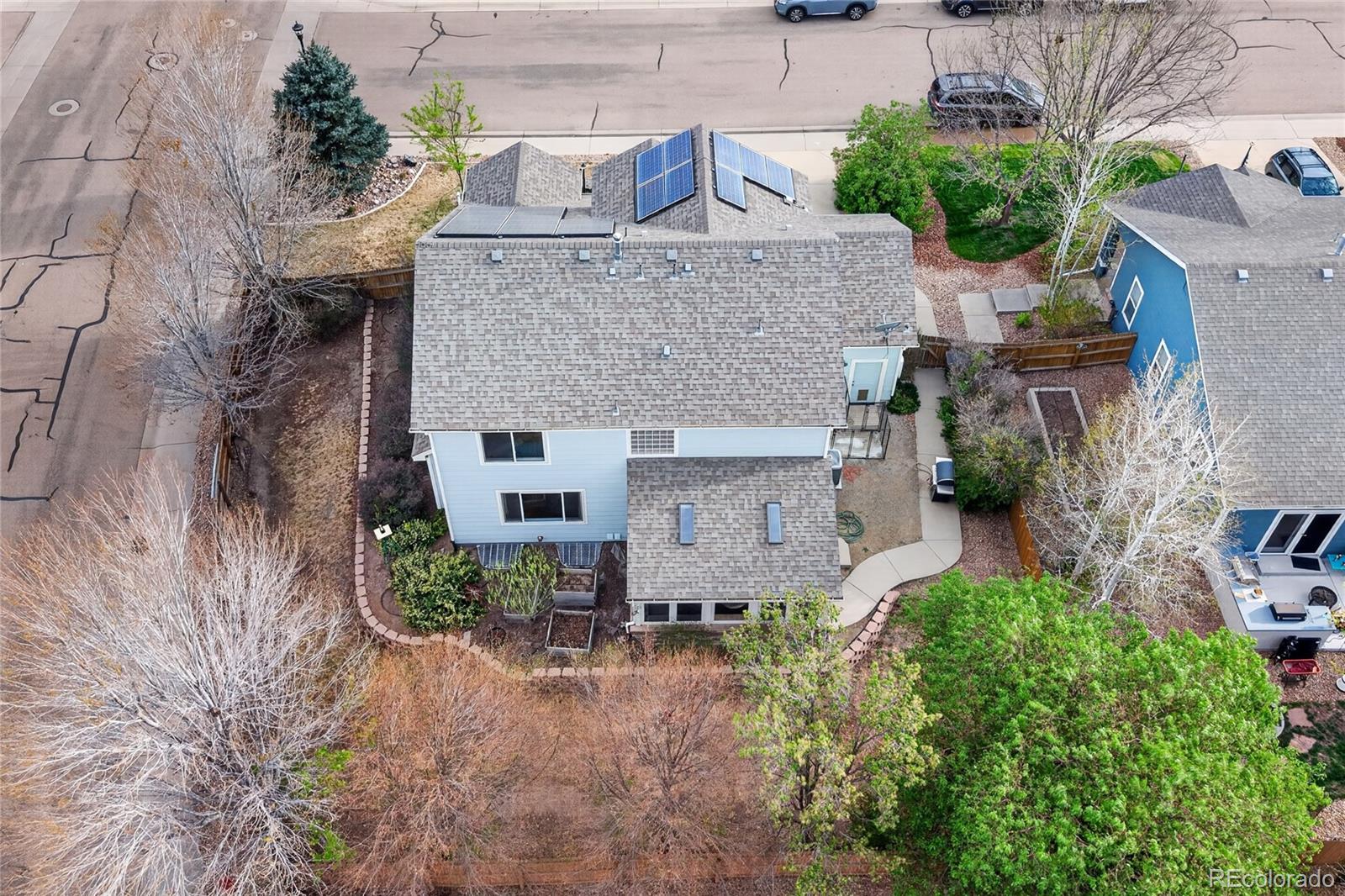 6289 Viewpoint Avenue Firestone, CO 80504 - Photo 38 of 45 an aerial view of a house with a yard and potted plants