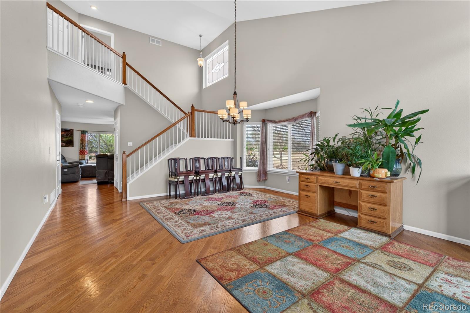 6289 Viewpoint Avenue Firestone, CO 80504 - Photo 5 of 45 a living room with furniture and a table
