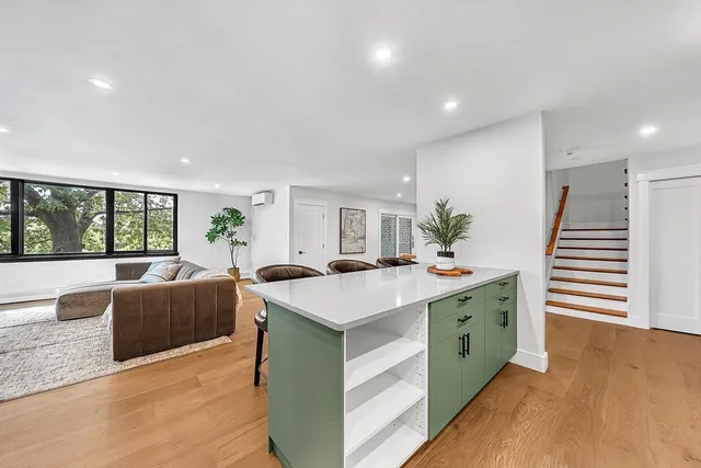 a view of kitchen with counter top space and living room