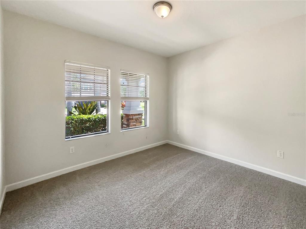 19491 Paddock View Drive Tampa, FL 33647 - Photo 11 of 28 an empty room with windows
