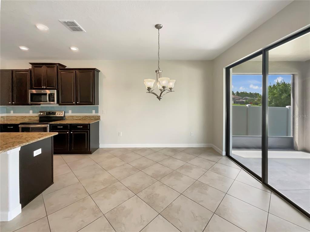 19491 Paddock View Drive Tampa, FL 33647 - Photo 17 of 28 a kitchen with stainless steel appliances granite countertop a stove and a sink