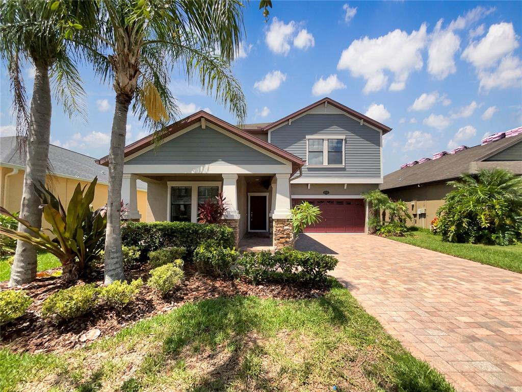 19491 Paddock View Drive Tampa, FL 33647 - Photo 9 of 28 a front view of house with yard and trees around