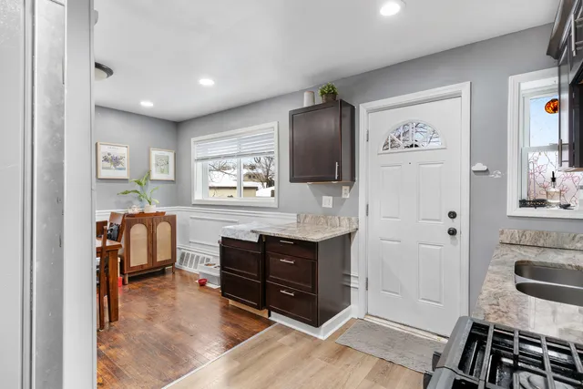 a hall with cabinets and a dresser