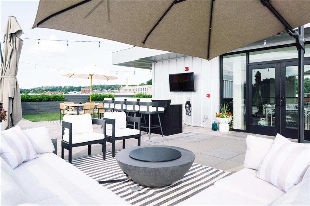 3725 Butler Street, Unit 304 Pittsburgh, PA 15201 - Photo 25 of 26 a outdoor space with furniture a flat screen tv