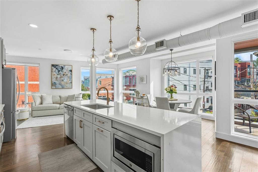 3725 Butler Street, Unit 304 Pittsburgh, PA 15201 - Photo 3 of 26 a large white kitchen with a large window