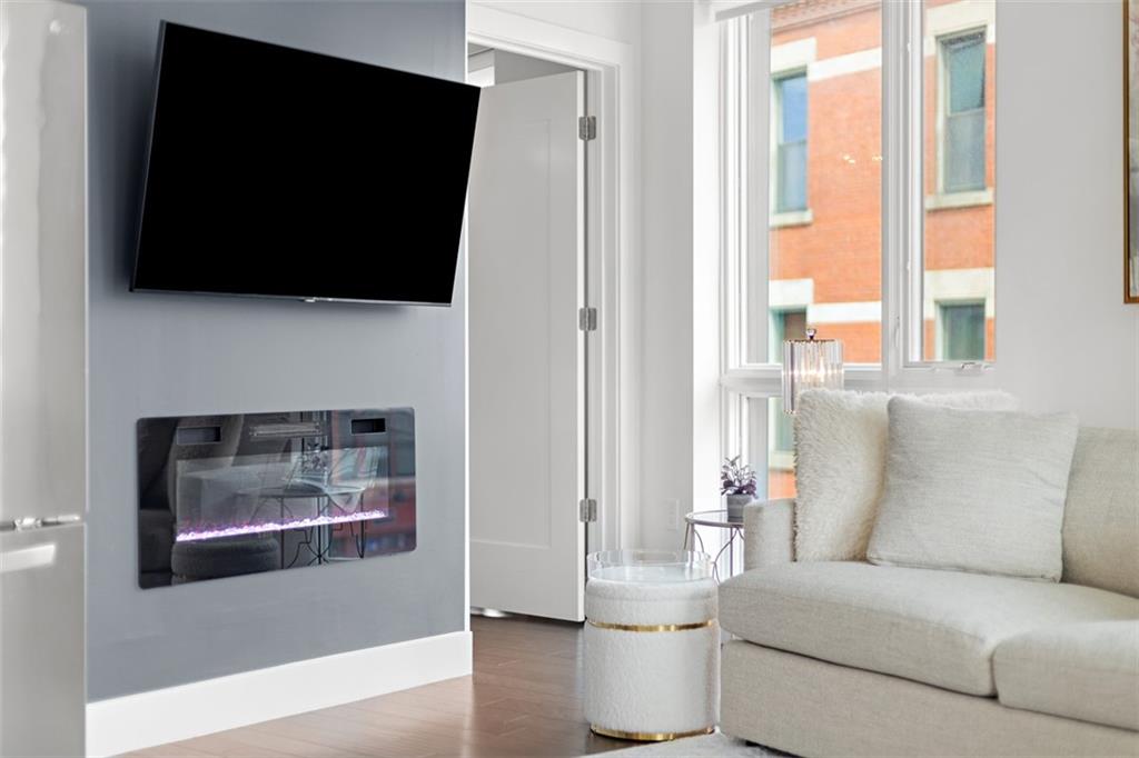 3725 Butler Street, Unit 304 Pittsburgh, PA 15201 - Photo 6 of 26 a living room with furniture and a flat screen tv