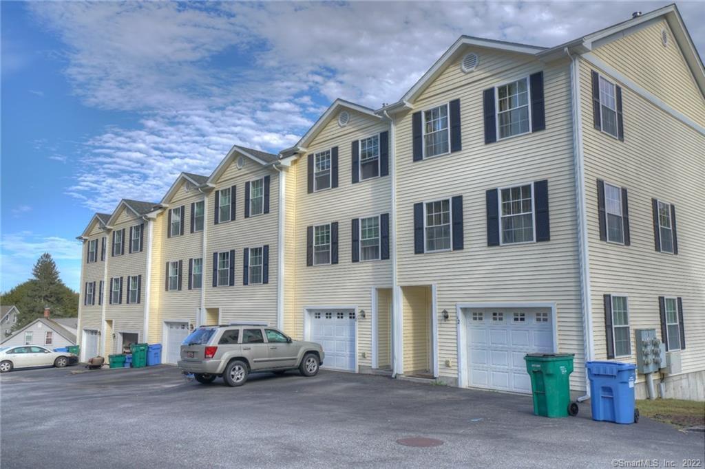 38 Hooper Street, Unit 10 Norwich, CT 06360 - Photo 1 of 1 a car parked in front of a building