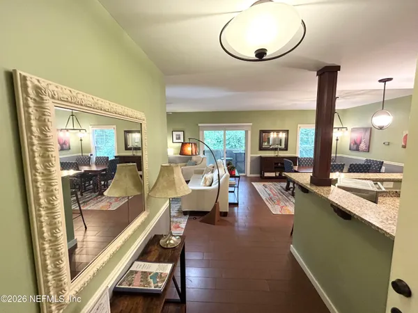 a living room with furniture and flat screen tv