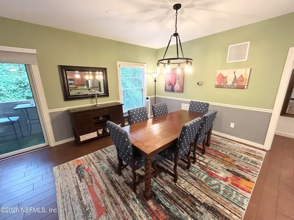 a kitchen with a refrigerator a stove top oven a sink and cabinets
