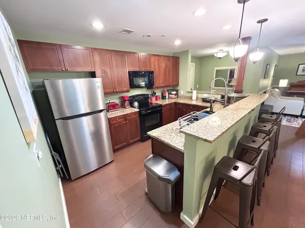 a kitchen with granite countertop lots of counter top space