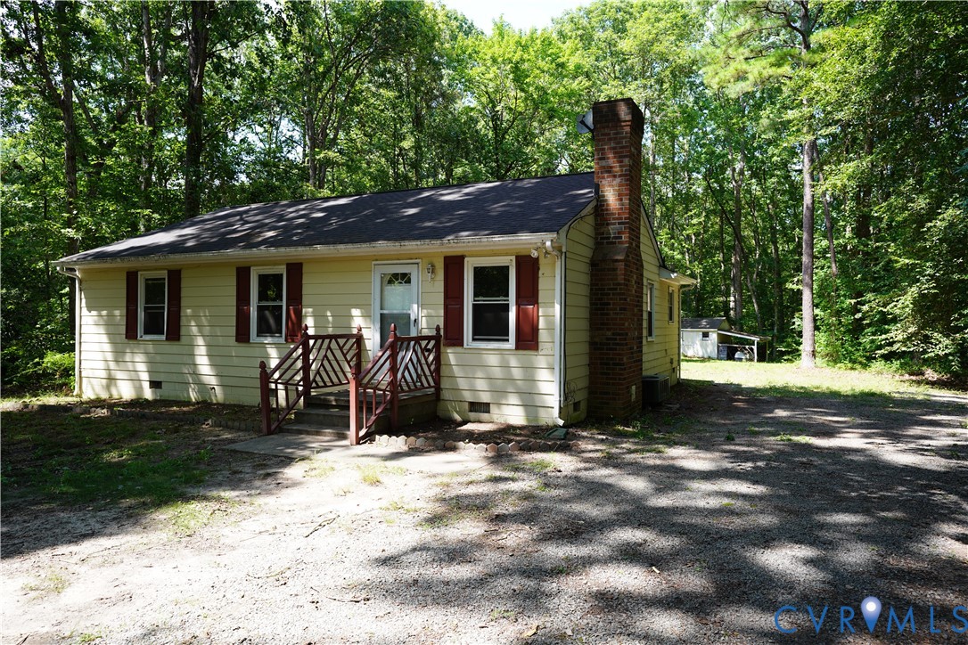 1439 Mahixon Road Manquin, VA 23106 - Photo 1 of 13 View of front of house with crawl space and a chim