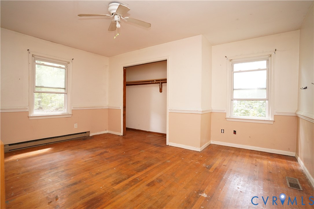 1439 Mahixon Road Manquin, VA 23106 - Photo 11 of 13 Unfurnished bedroom with wood-type flooring, baseb