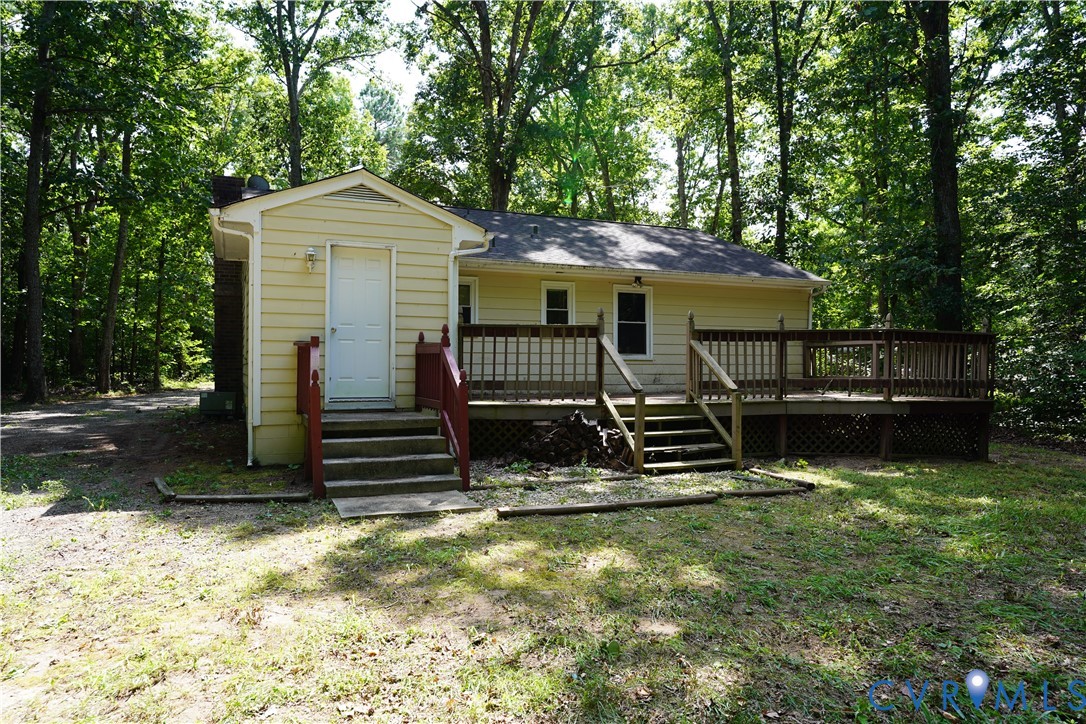 1439 Mahixon Road Manquin, VA 23106 - Photo 3 of 13 Rear view of house featuring a wooden deck, view o