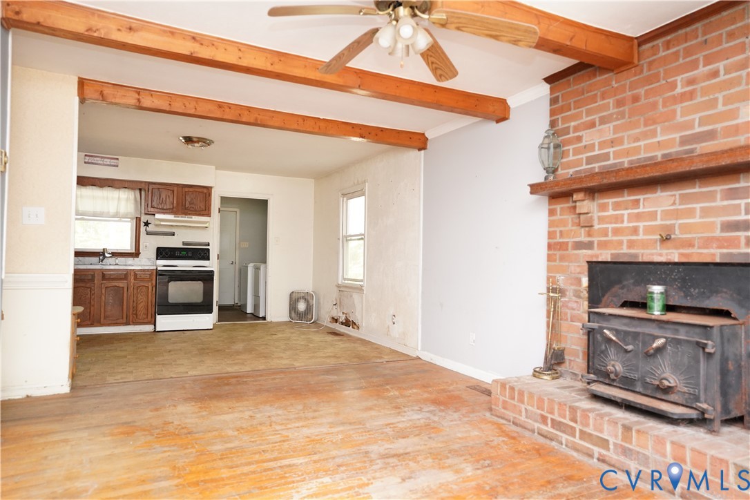 1439 Mahixon Road Manquin, VA 23106 - Photo 4 of 13 Unfurnished living room featuring light wood-style