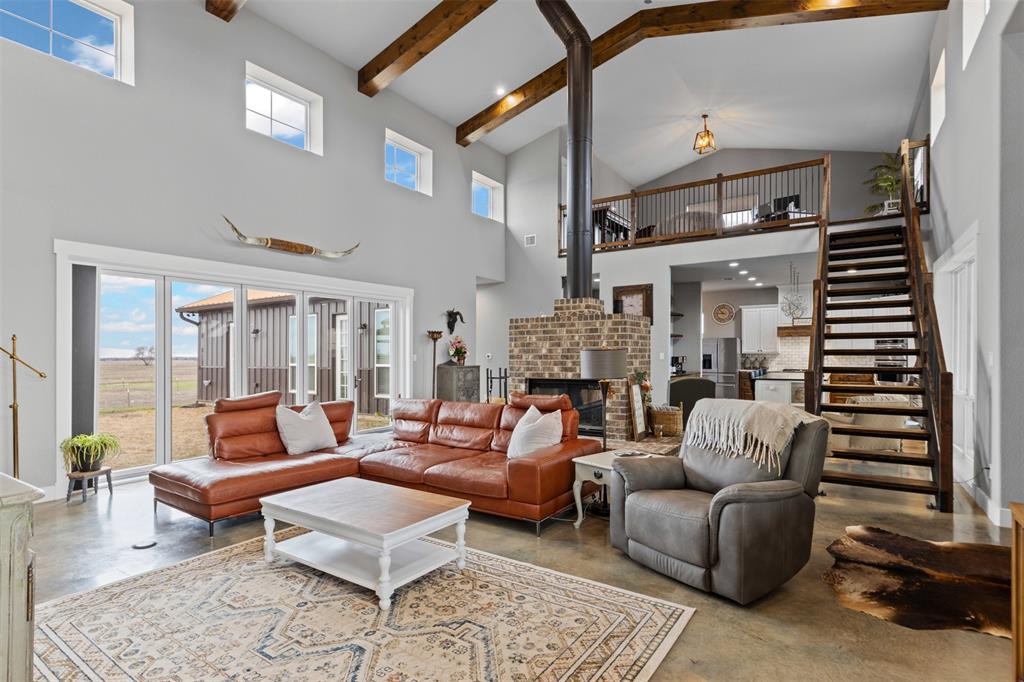 201 W Road Waxahachie, TX 75165 - Photo 14 of 40 a living room with furniture and a fireplace