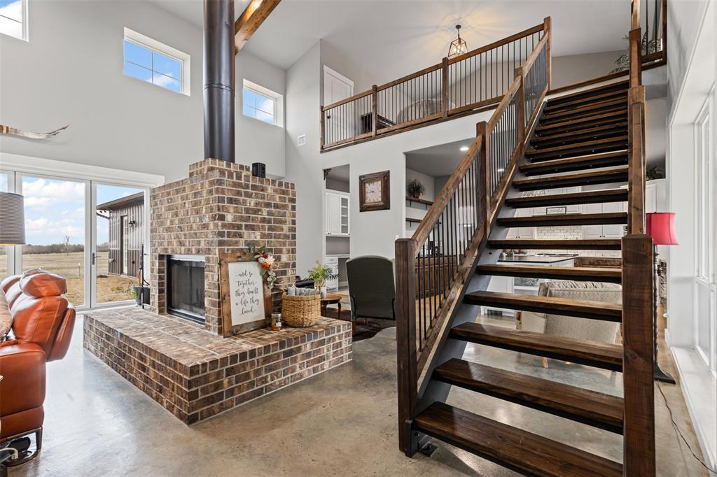 201 W Road Waxahachie, TX 75165 - Photo 16 of 40 a living room with furniture and a fireplace