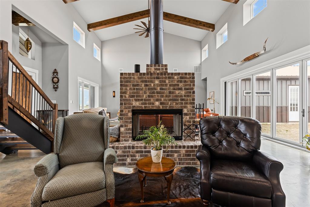 201 W Road Waxahachie, TX 75165 - Photo 17 of 40 a living room with furniture fireplace and a large window