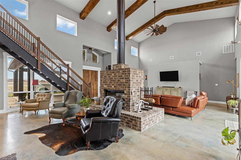 201 W Road Waxahachie, TX 75165 - Photo 18 of 40 a living room with furniture and a flat screen tv