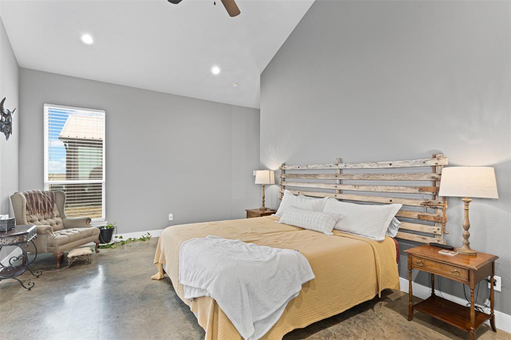 201 W Road Waxahachie, TX 75165 - Photo 27 of 40 a bedroom with a bed and a couch