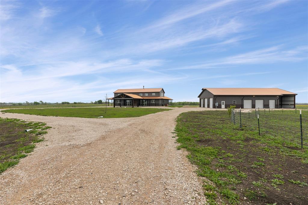 201 W Road Waxahachie, TX 75165 - Photo 30 of 40 a view of a lake with houses in the back