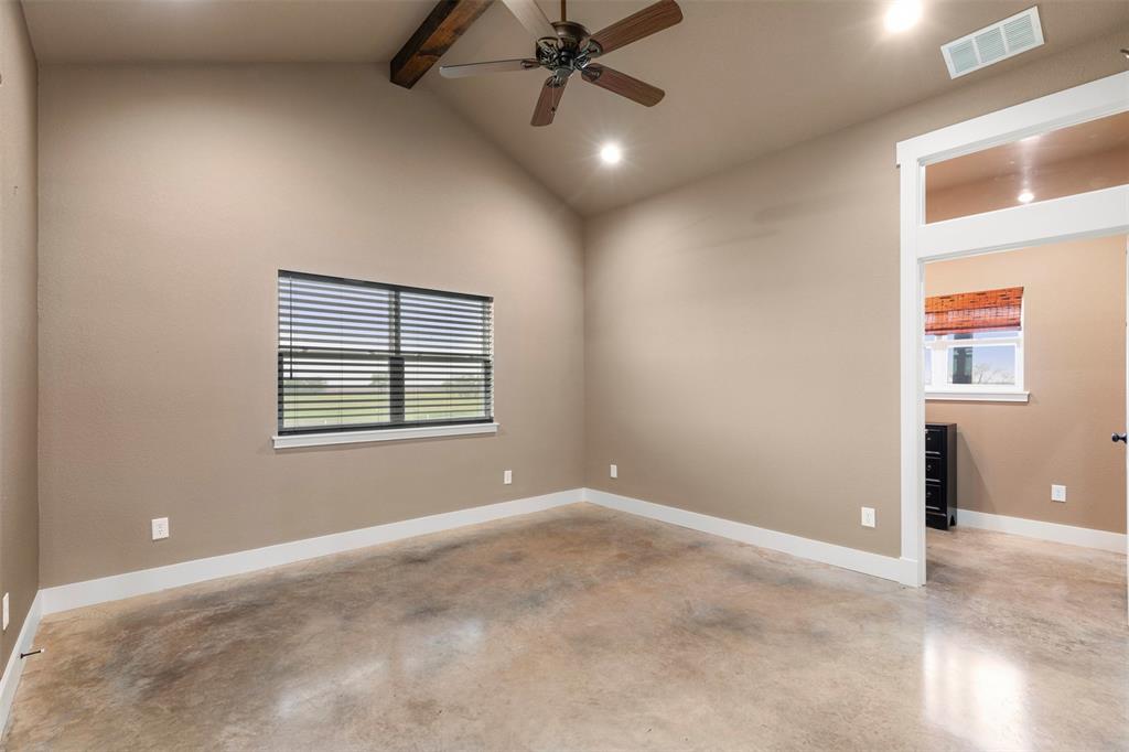 201 W Road Waxahachie, TX 75165 - Photo 39 of 40 an empty room with windows and fan