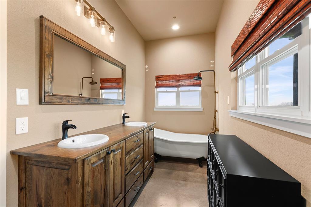 201 W Road Waxahachie, TX 75165 - Photo 40 of 40 a bathroom with a sink and a mirror