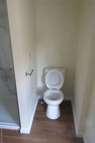 a bathroom with a toilet and a sink