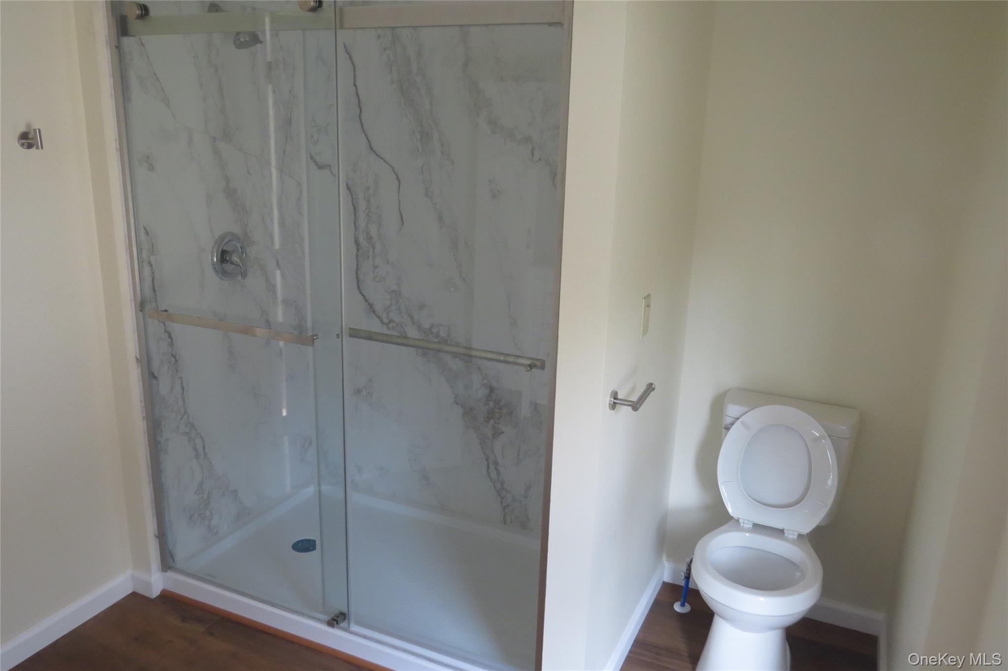 723 Beekman, Unit 64 Hopewell Junction, NY 12524 - Photo 18 of 28 a bathroom with a toilet and a shower