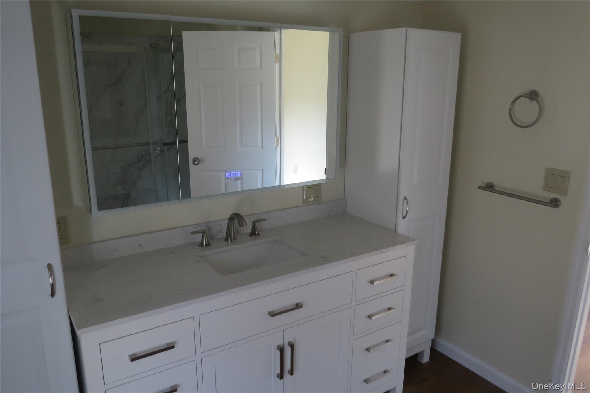 723 Beekman, Unit 64 Hopewell Junction, NY 12524 - Photo 19 of 28 a bathroom with a granite countertop sink and mirror