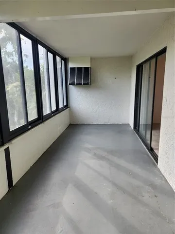 a view of a swimming pool with a yard