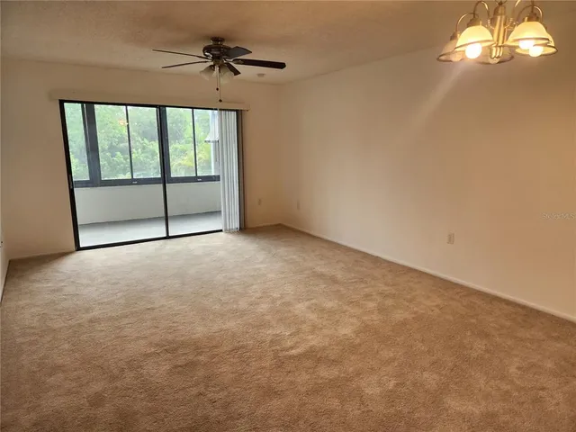 an empty room with windows and entrance