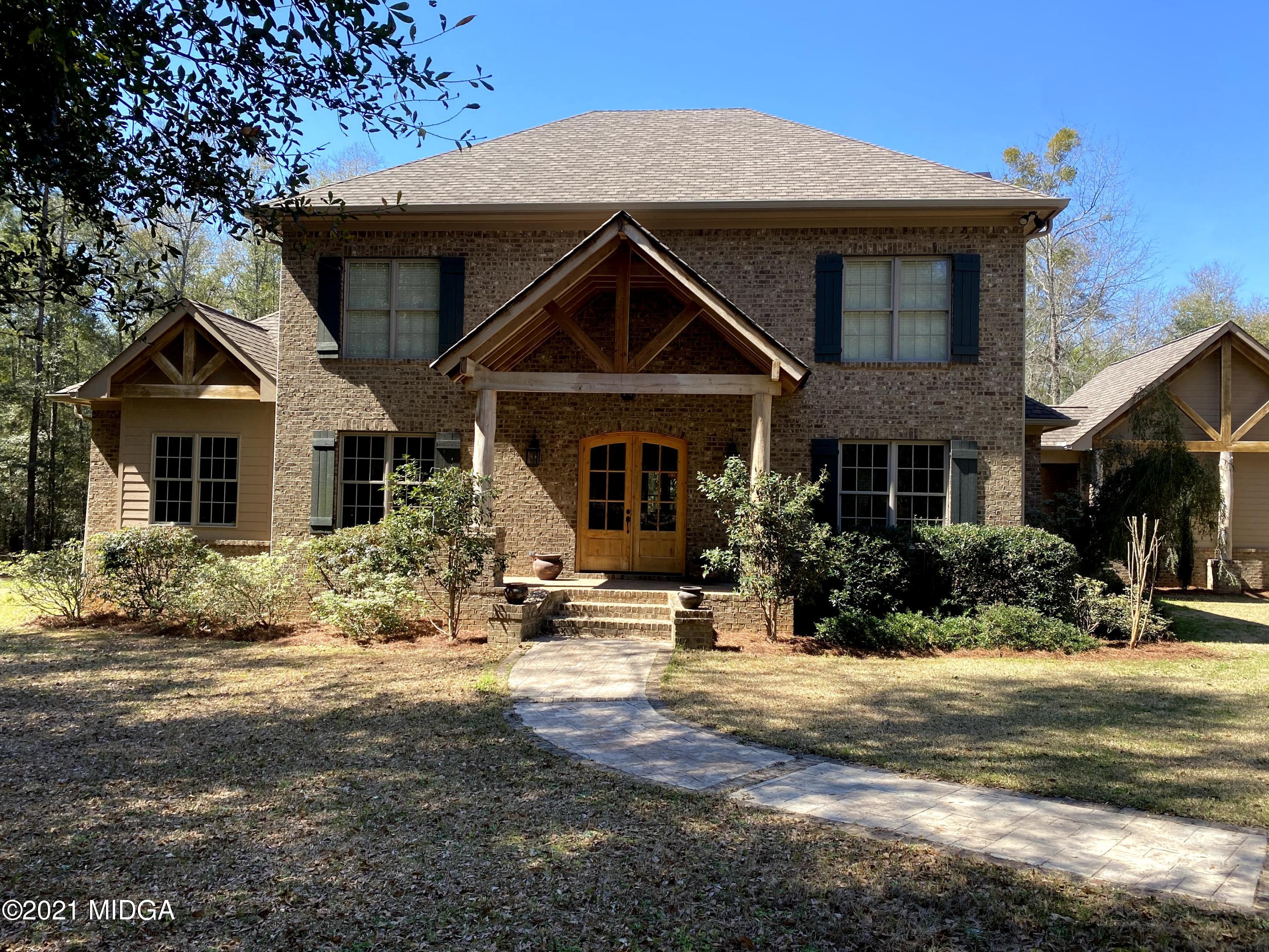 619 Harper Road Perry, GA 31069 - Photo 2 of 27 a front view of a house with a yard