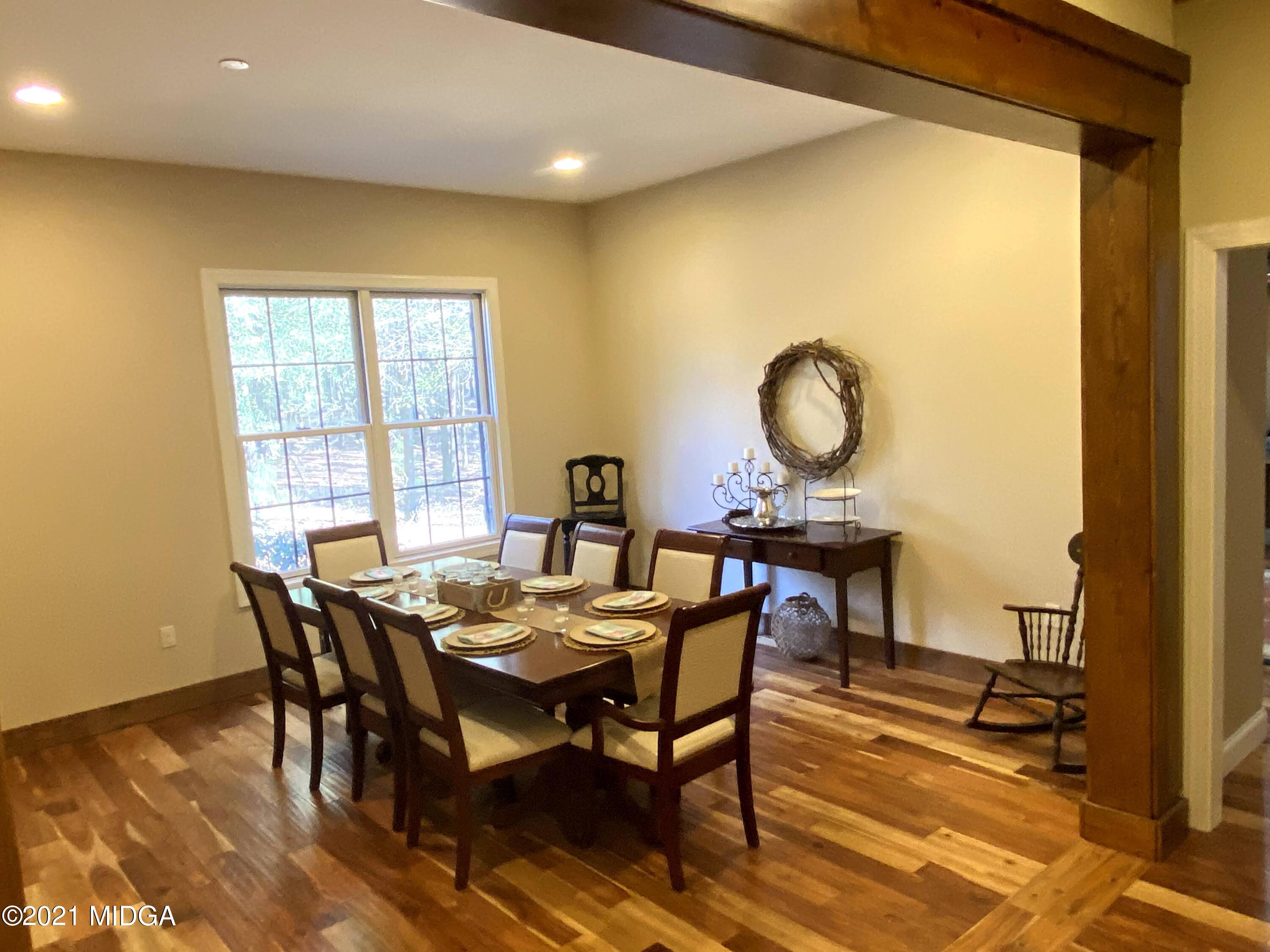 619 Harper Road Perry, GA 31069 - Photo 11 of 27 a view of a dining room with furniture and wooden floor