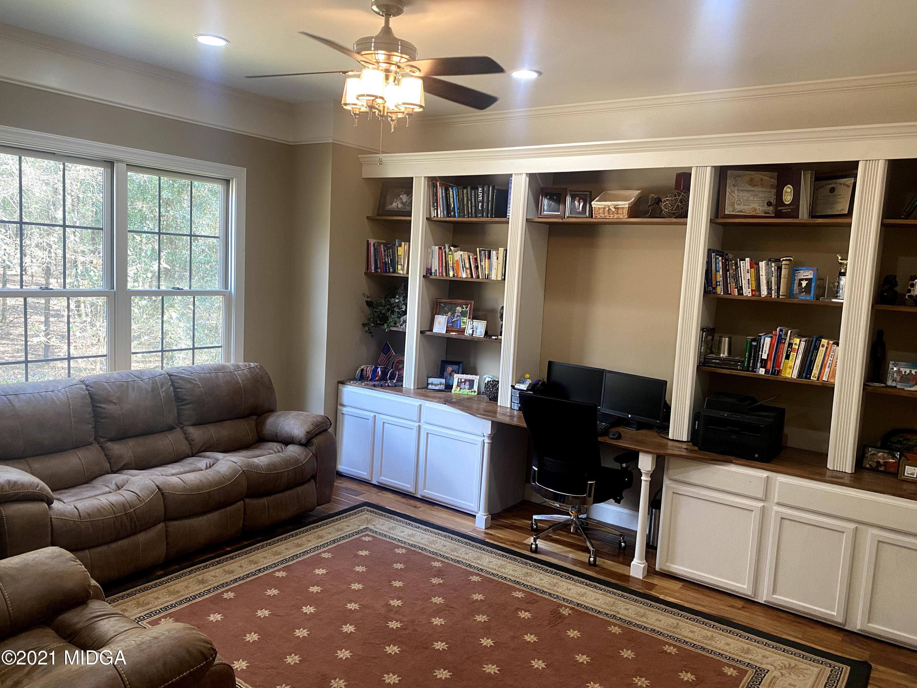 619 Harper Road Perry, GA 31069 - Photo 12 of 27 a livingroom with workspace and a couch
