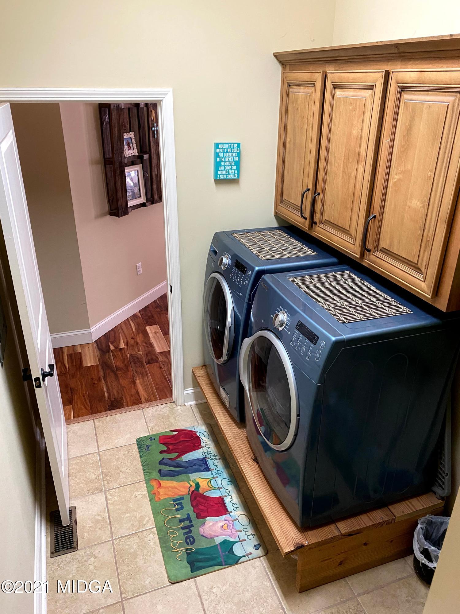 619 Harper Road Perry, GA 31069 - Photo 17 of 27 a utility room with dryer and washer
